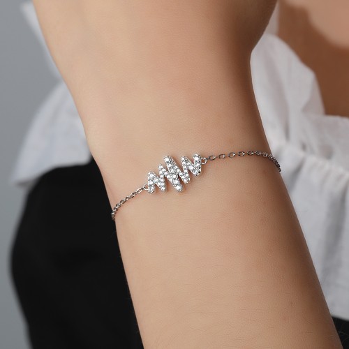 Spiralux - Pulsera ajustable de moissanita con símbolo en pavé