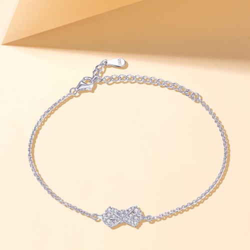 Gleamique - Pulsera con motivo de lazo de moissanita y cadena ajustable
