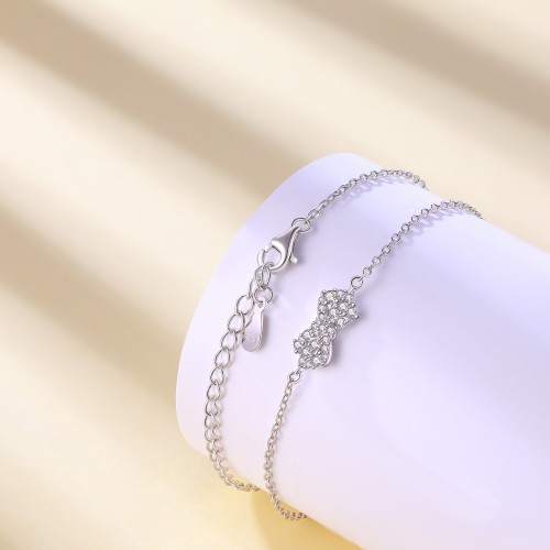Gleamique - Pulsera con motivo de lazo de moissanita y cadena ajustable